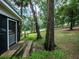 Charming home exterior with a screened porch and mature trees at 24750 Ne 177Th Ter, Fort Mc Coy, FL 32134