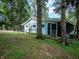 Charming light blue home nestled in a wooded area at 24750 Ne 177Th Ter, Fort Mc Coy, FL 32134