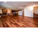Large basement with laminate wood floors, a stone fireplace, and a kitchenette at 24750 Ne 177Th Ter, Fort Mc Coy, FL 32134