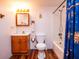 Bathroom features a shower/tub combo and wood-look floors at 24750 Ne 177Th Ter, Fort Mc Coy, FL 32134