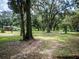 Large grassy yard with mature trees and a country feel at 24750 Ne 177Th Ter, Fort Mc Coy, FL 32134