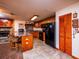 Kitchen with wood cabinets, granite counters, and black appliances at 24750 Ne 177Th Ter, Fort Mc Coy, FL 32134