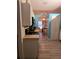 Bright kitchen with stainless steel appliances and light wood laminate flooring at 6995 Se 22Nd Ave, Ocala, FL 34480