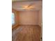 Bright bedroom with light brown wood flooring and a ceiling fan at 6995 Se 22Nd Ave, Ocala, FL 34480