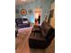 Living room with leather recliner and view into another room at 6995 Se 22Nd Ave, Ocala, FL 34480