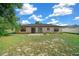 Large backyard with grassy area and patio at 25 Cedar Ter, Ocala, FL 34472