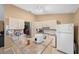Kitchen with white appliances and a breakfast bar at 25 Cedar Ter, Ocala, FL 34472