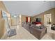 Open concept living room with sectional sofa and entryway view at 25 Cedar Ter, Ocala, FL 34472