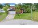 Single-Gathering home with attached garage and a palm tree at 25 Cedar Ter, Ocala, FL 34472