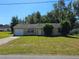 Single-story home with a one-car garage and well-maintained lawn at 4 Spring Trl, Ocala, FL 34472
