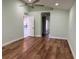 Bright and spacious living room with wood-look flooring at 8028 Se 62Nd Ln, Ocala, FL 34472