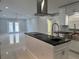 Spacious kitchen with an island, stainless steel appliances, and breakfast bar at 8028 Se 62Nd Ln, Ocala, FL 34472