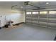Bright and airy garage featuring overhead storage and a clean floor at 8028 Se 62Nd Ln, Ocala, FL 34472