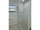 Updated shower with glass enclosure and modern fixtures at 8028 Se 62Nd Ln, Ocala, FL 34472