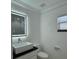 Modern bathroom with updated vanity, large mirror, and glass shower at 8028 Se 62Nd Ln, Ocala, FL 34472
