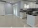 Modern kitchen with large island and stainless steel appliances at 8028 Se 62Nd Ln, Ocala, FL 34472