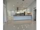 Modern kitchen with large island and stainless steel appliances at 8028 Se 62Nd Ln, Ocala, FL 34472