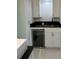 Convenient wet bar with wine cooler and granite countertop at 8028 Se 62Nd Ln, Ocala, FL 34472