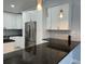 Modern kitchen with stainless steel appliances and granite countertops at 8028 Se 62Nd Ln, Ocala, FL 34472