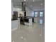 Modern kitchen with large island and stainless steel appliances at 8028 Se 62Nd Ln, Ocala, FL 34472