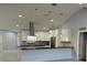 Modern kitchen with large island and stainless steel appliances at 8028 Se 62Nd Ln, Ocala, FL 34472
