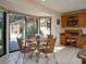 Kitchen breakfast nook with glass table and wicker chairs at 12750 W Highway 40, Ocala, FL 34481