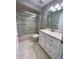 Bathroom with a bathtub, shower, and white vanity at 9526 Sw 72Nd Ct, Ocala, FL 34476