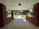 Brick front porch offers a view of the property and walkway at 9526 Sw 72Nd Ct, Ocala, FL 34476