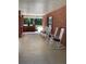 Relaxing front porch with rocking chairs and a swing at 9526 Sw 72Nd Ct, Ocala, FL 34476