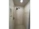 Shower with marble-like walls and a built-in water filter at 9526 Sw 72Nd Ct, Ocala, FL 34476