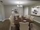 Formal dining room with large wooden table and chandelier at 9526 Sw 72Nd Ct, Ocala, FL 34476