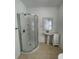 Bathroom with a pedestal sink, shower, and white vanity at 9526 Sw 72Nd Ct, Ocala, FL 34476