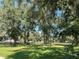 Spacious pasture with mature oak trees and a wooden fence at 9526 Sw 72Nd Ct, Ocala, FL 34476