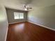 Bright bedroom featuring wood-look floors and a window at 9526 Sw 72Nd Ct, Ocala, FL 34476