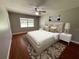 Bedroom with a queen bed and wood-look floors at 9526 Sw 72Nd Ct, Ocala, FL 34476