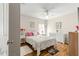 Bright bedroom with a queen bed, wood flooring, and window at 5676 Sw 40Th Pl, Ocala, FL 34474