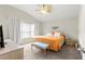 Spacious bedroom with king bed, carpet flooring, and window at 5676 Sw 40Th Pl, Ocala, FL 34474