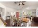 Dining area with hardwood floors and a wooden table at 5676 Sw 40Th Pl, Ocala, FL 34474