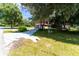 House with a red roof and a spacious front yard at 1331 Se 169Th Terrace Rd, Silver Springs, FL 34488