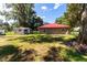 House with a red roof and a large backyard at 1331 Se 169Th Terrace Rd, Silver Springs, FL 34488