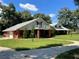 Two-story home with brick exterior and a balcony at 9526 Sw 72Nd Ct, Ocala, FL 34476