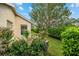 Landscaped backyard with flowering bushes and privacy hedge at 6470 Sw 50Th Ct, Ocala, FL 34474