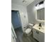 Modern bathroom with white vanity and grey flooring at 5 Hickory Track Run, Ocala, FL 34472