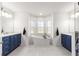 Luxurious bathroom with a freestanding tub, dual vanities, and a spacious layout at 5615 Nw 202Nd Pl, Mc Intosh, FL 32664