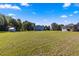 Large backyard with plenty of space for outdoor activities at 5615 Nw 202Nd Pl, Mc Intosh, FL 32664