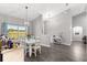 Dining area with a large window and a view of the backyard at 5615 Nw 202Nd Pl, Mc Intosh, FL 32664