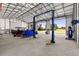 Workshop with open doors, providing views of the surrounding landscape at 5615 Nw 202Nd Pl, Mc Intosh, FL 32664