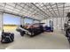 Bright and airy workshop with multiple overhead doors at 5615 Nw 202Nd Pl, Mc Intosh, FL 32664