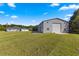 Detached workshop with three garage doors at 5615 Nw 202Nd Pl, Mc Intosh, FL 32664