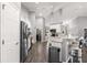 Modern kitchen features stainless steel appliances and white cabinetry at 5615 Nw 202Nd Pl, Mc Intosh, FL 32664